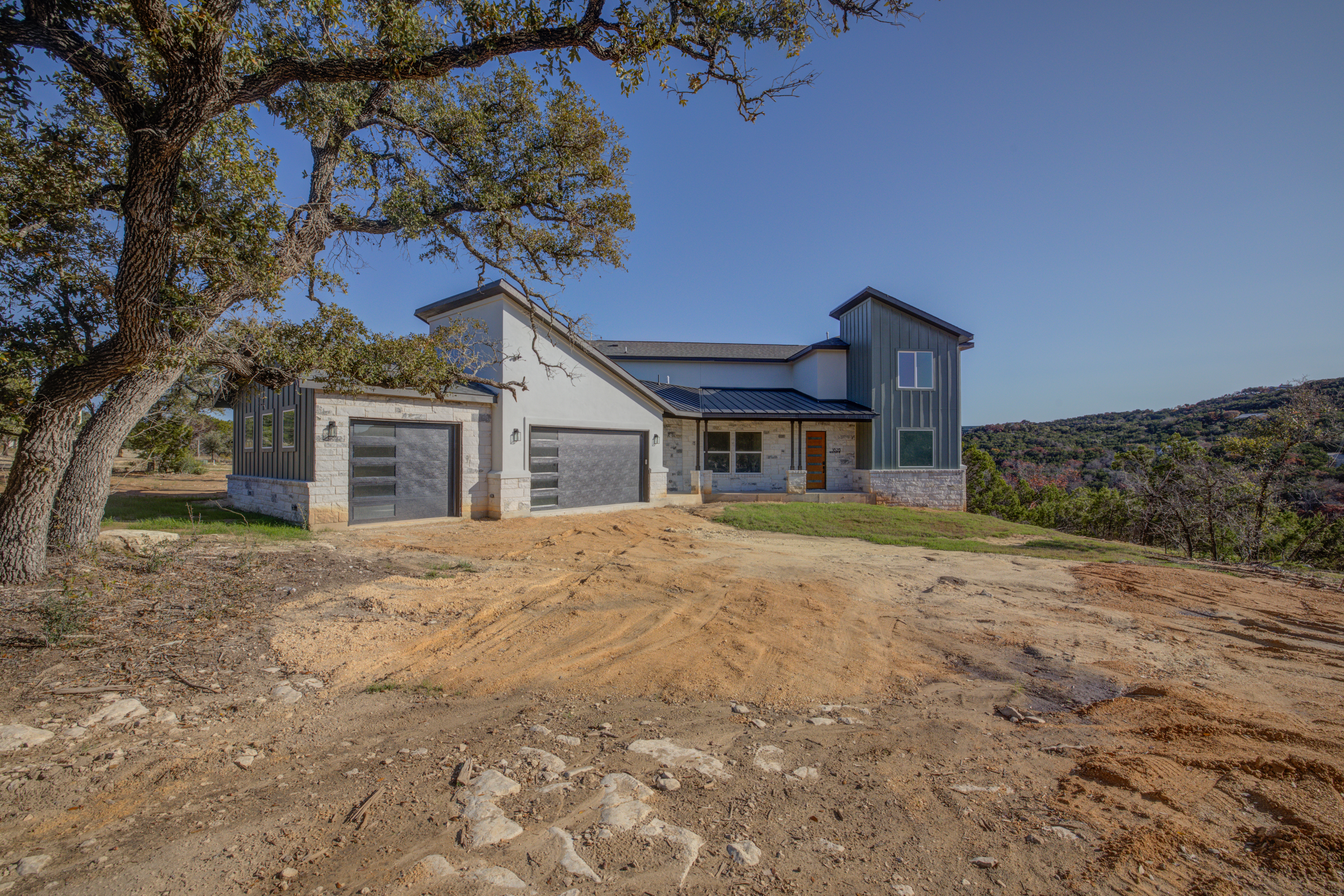 20-Acre Travis County Portfolio — Three Contiguous Tracts with Luxury Home + Adjacent 5-Acre Site